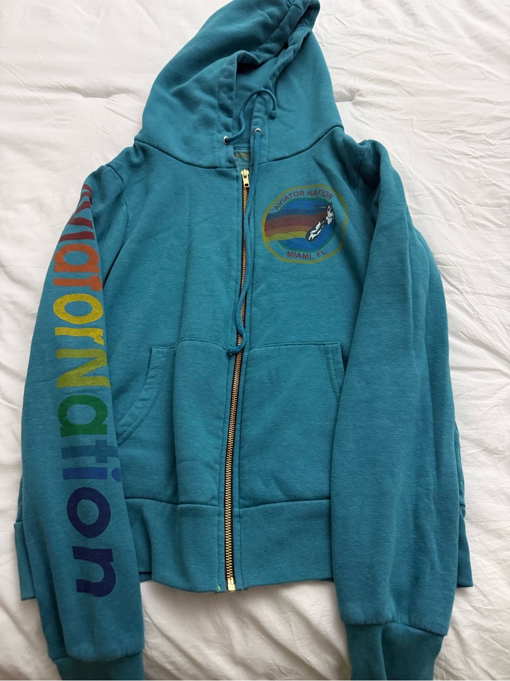 Aviator Nation Teal women zip up with Rainbow Sleeve Logo